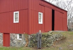 Bob Muller standing in front of the barn.  Click for a higher 
        resolution picture